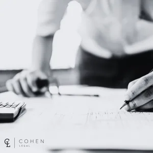 Cohen Legal - Lawyer reviewing retaining wall engineering plans in North Queensland