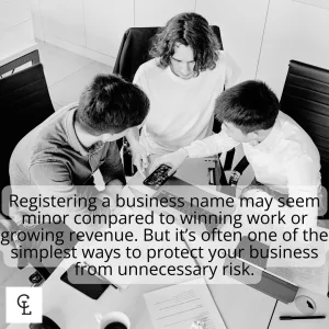 Business Owner Working On Laptop With Branding Materials