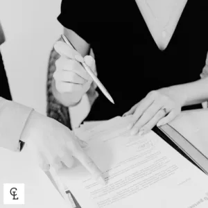 Sam Cohen, Principal Lawyer at Cohen Legal Townsville, reviewing a commercial contract with a business client