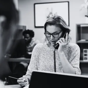 Employee on phone at workplace — carer's leave rights Fair Work Act Australia